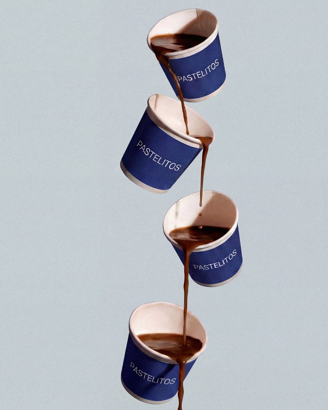 Coffee pouring through a tower of Pastelitos cups