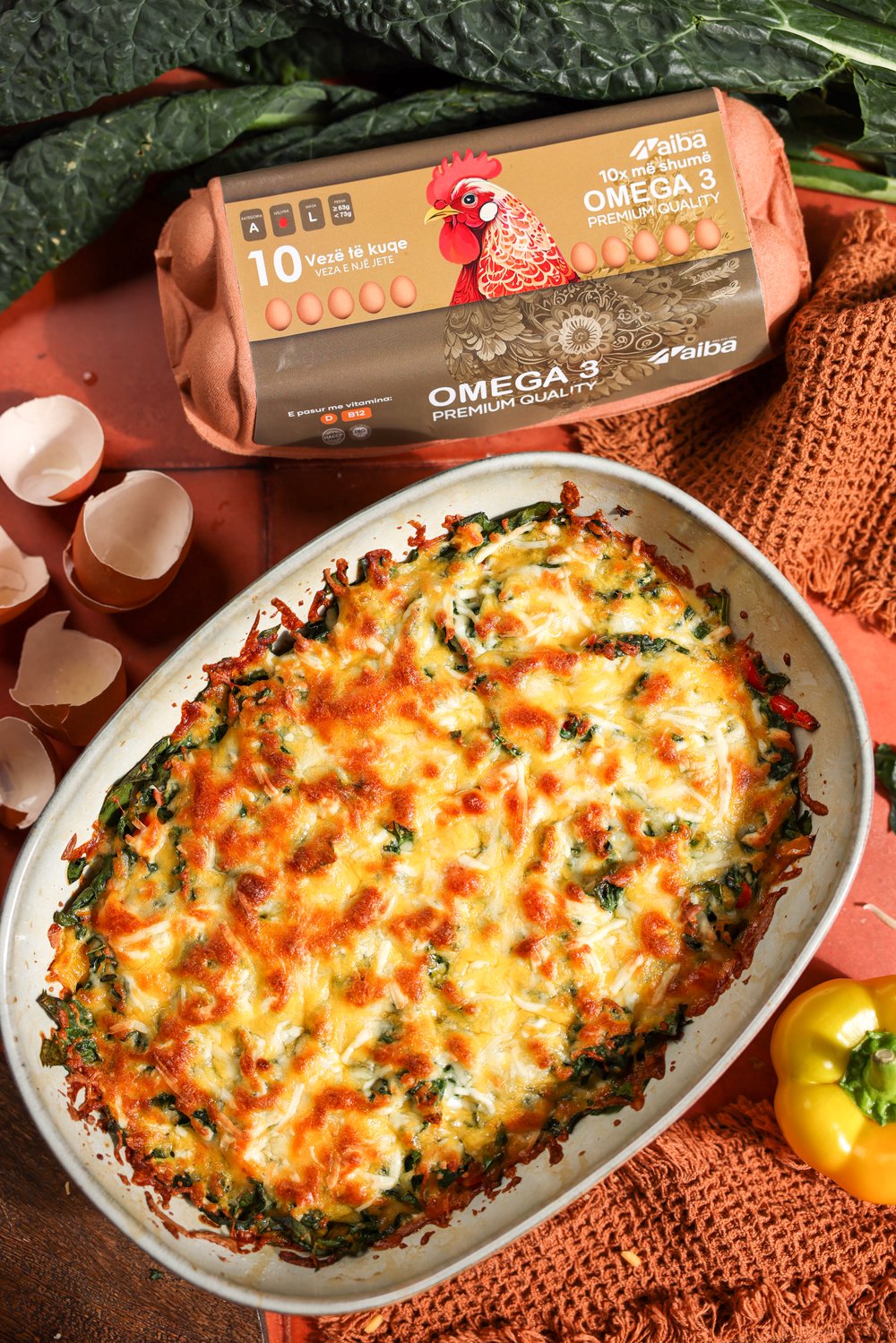 Baked vegetable and egg tava beside an AIBA Omega 3 carton