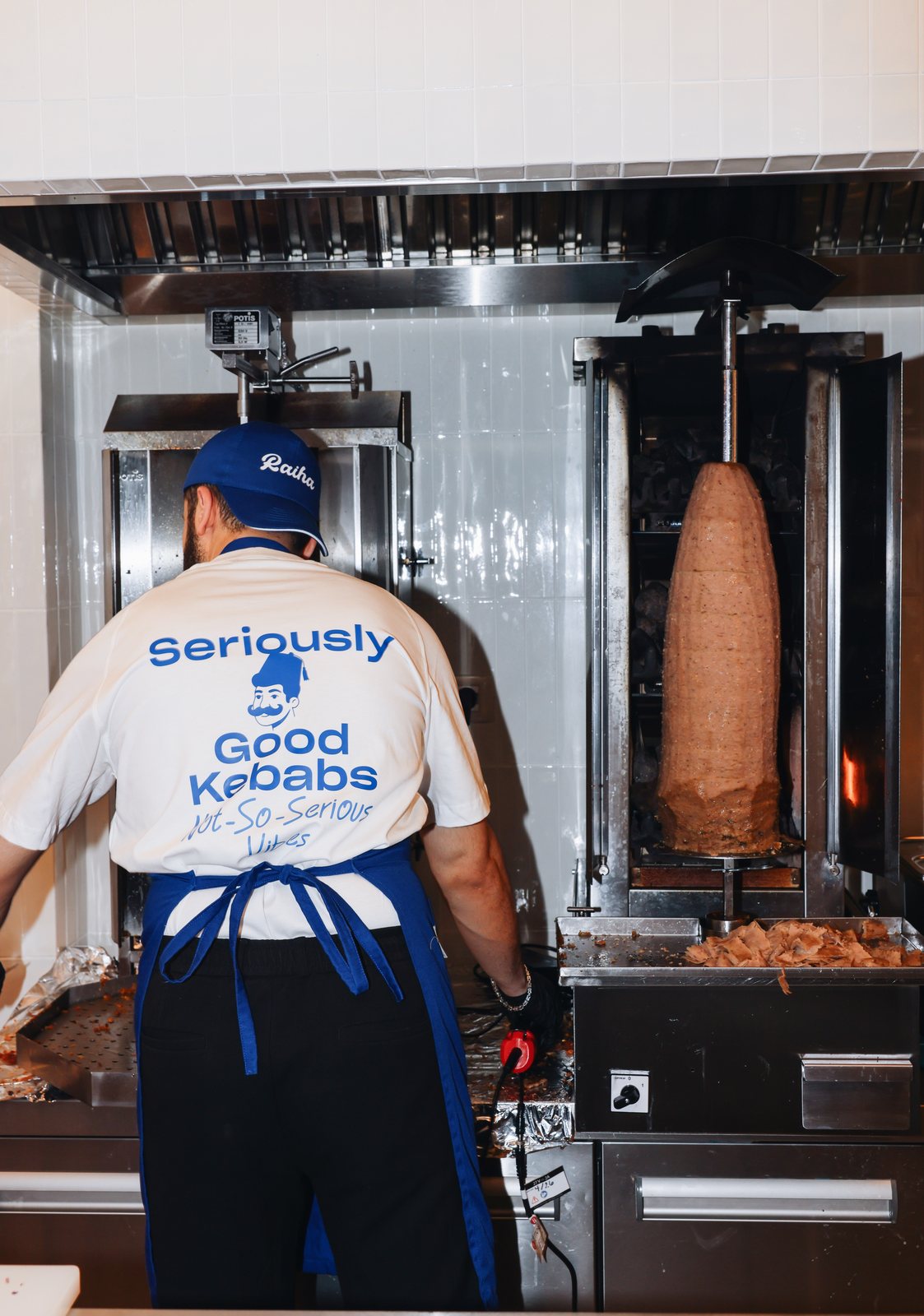 Chef in a Seriously Good Kebabs t-shirt at the rotisserie