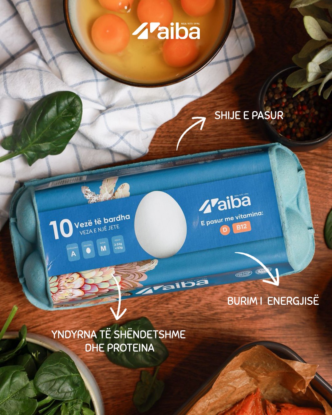 AIBA white egg carton with benefits on a wooden table