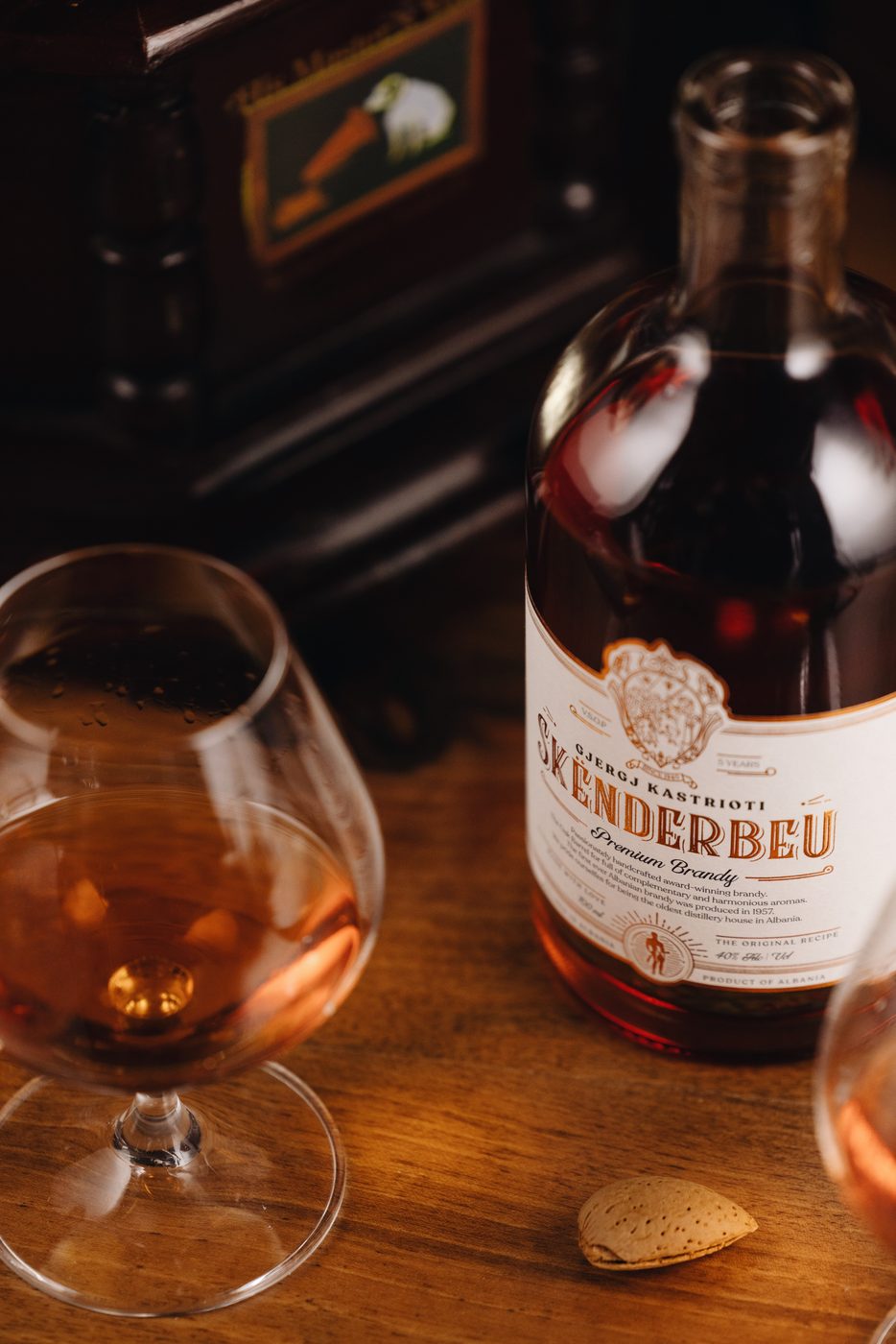 Skënderbeu Premium Brandy with a snifter and an almond