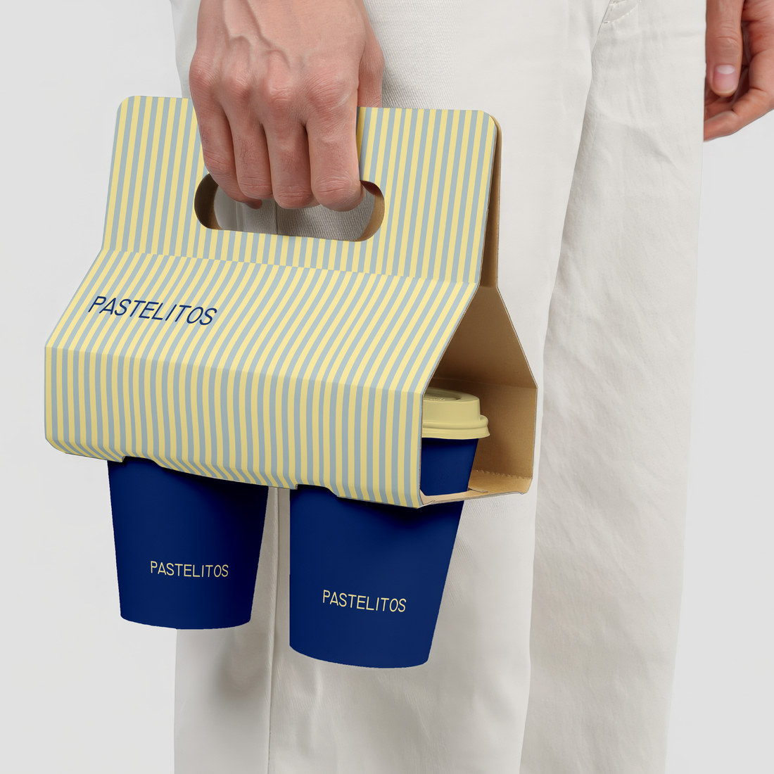 Striped Pastelitos cup carrier with navy coffee cups