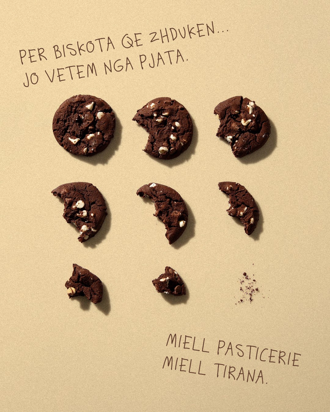 Chocolate cookies disappearing bite by bite, pastry flour