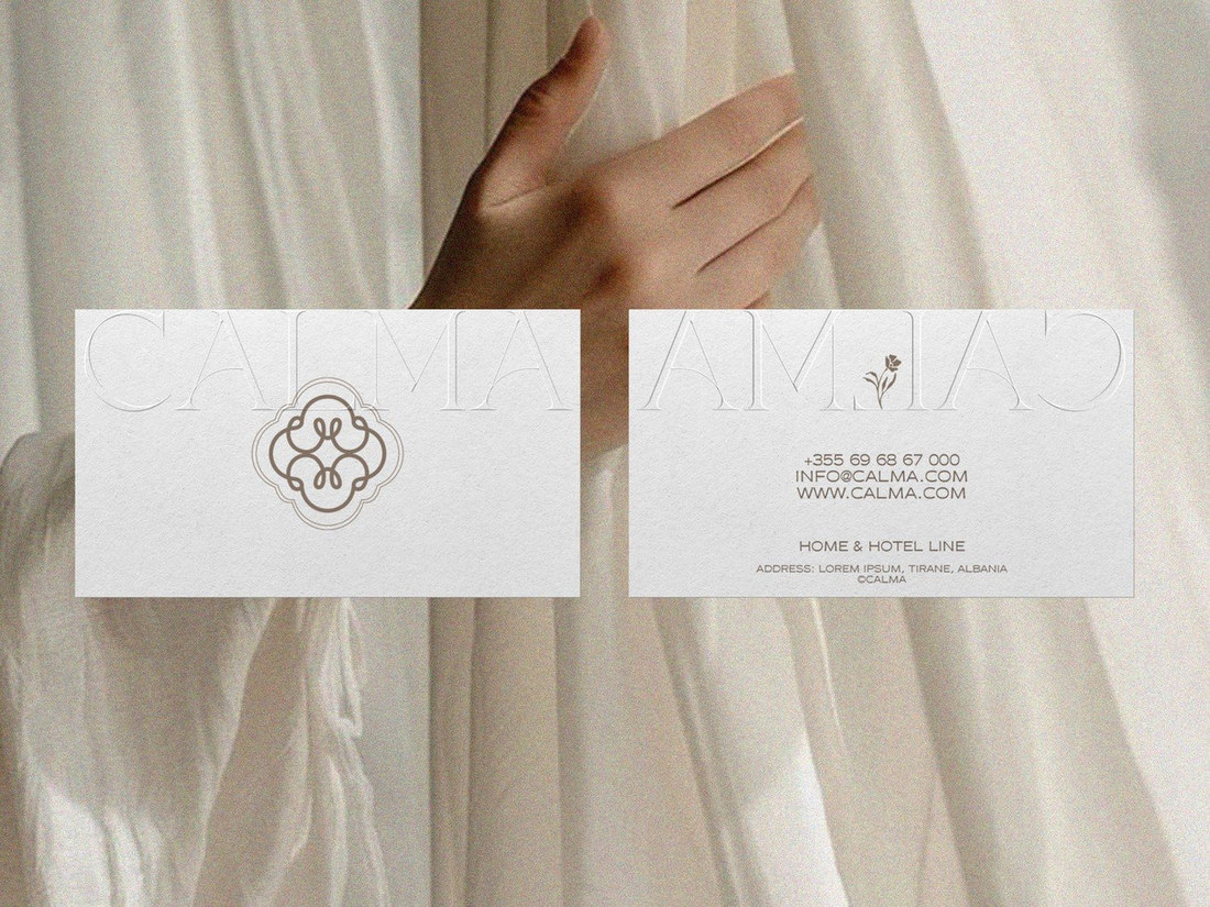 Embossed Calma business cards front and back