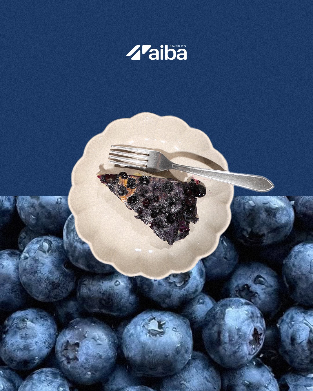 Slice of blueberry clafoutis over fresh blueberries
