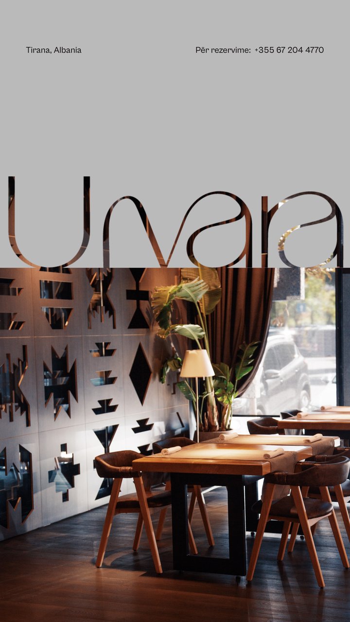Story: the Ujvara wordmark cut over the dining room, with reservation number