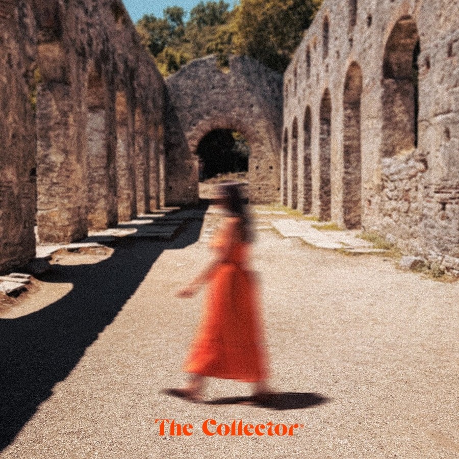 Figure in a red dress walking through Butrint ruins