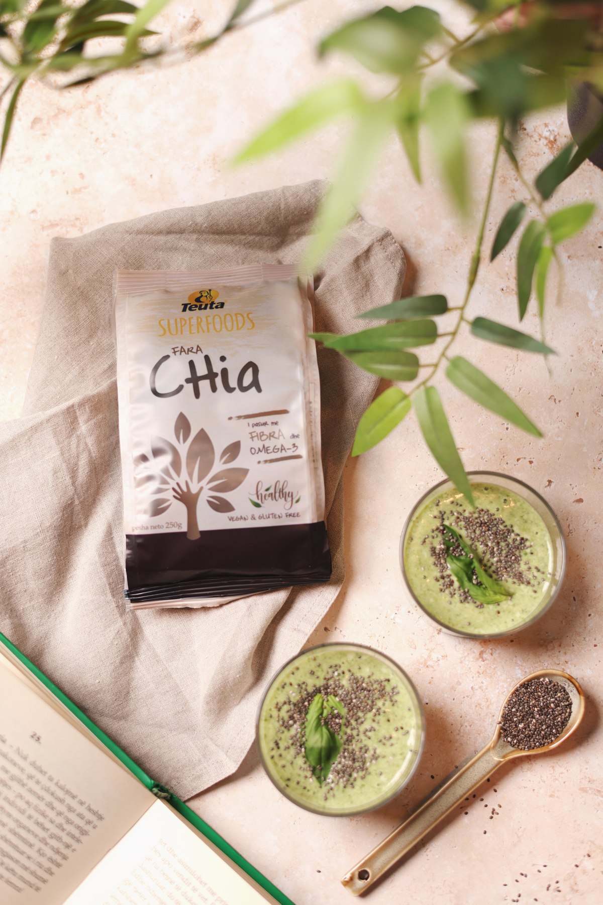 Teuta Superfoods chia pack beside two green smoothies topped with chia