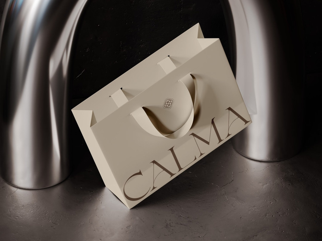 Calma paper shopping bag in a dark sculptural setting