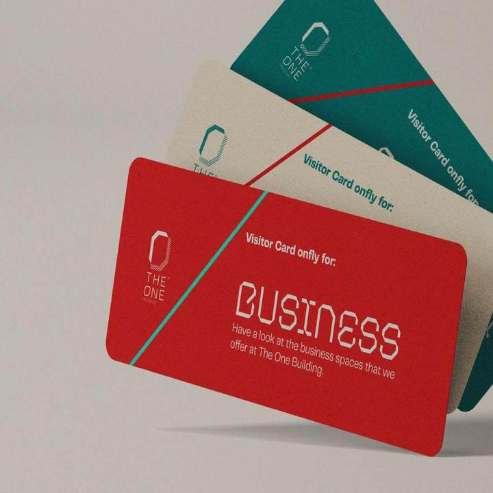 The One visitor cards in teal, gypsum and red with the wordmark and diagonal accent
