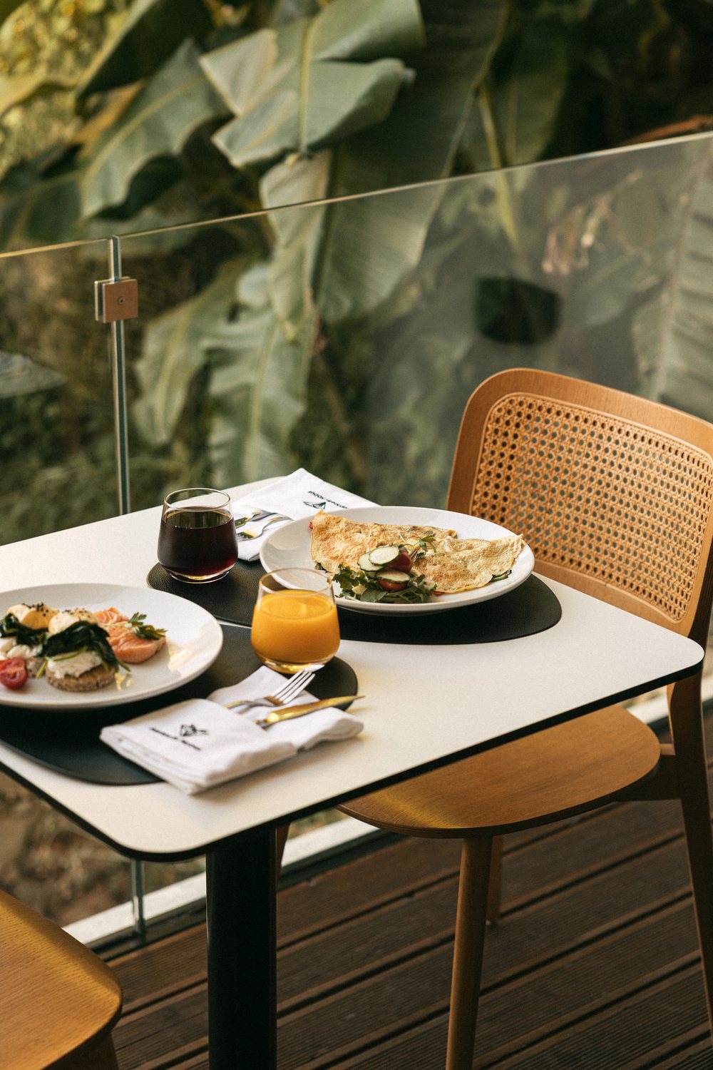 Breakfast for two on the terrace: omelette, eggs Benedict and fresh juice