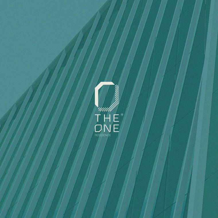 The One Residence wordmark on the building facade, shot from below