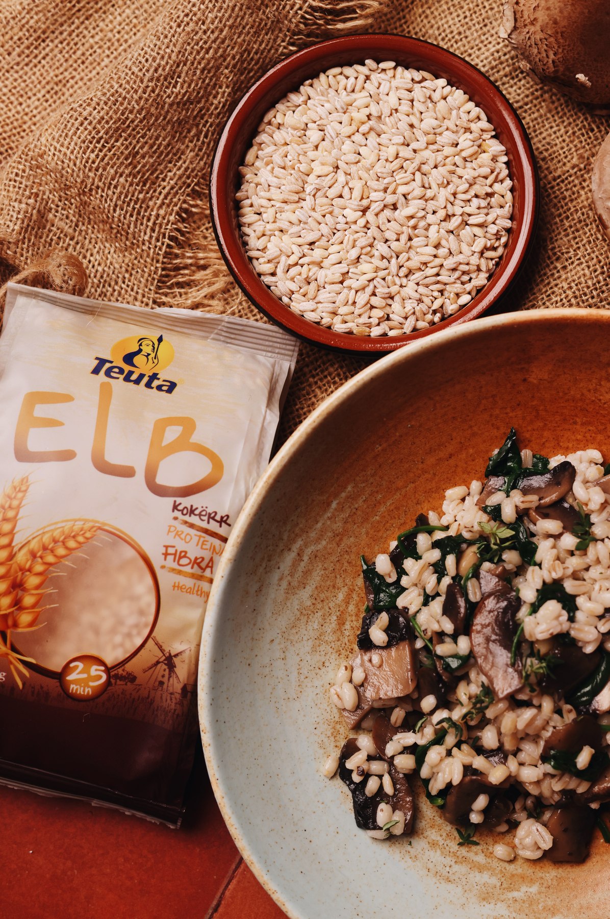 Barley risotto with mushrooms and spinach beside a Teuta ELB pack