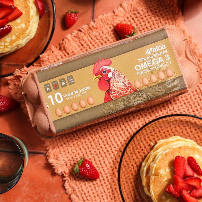 AIBA Omega 3 carton with pancakes and strawberries on a terracotta table