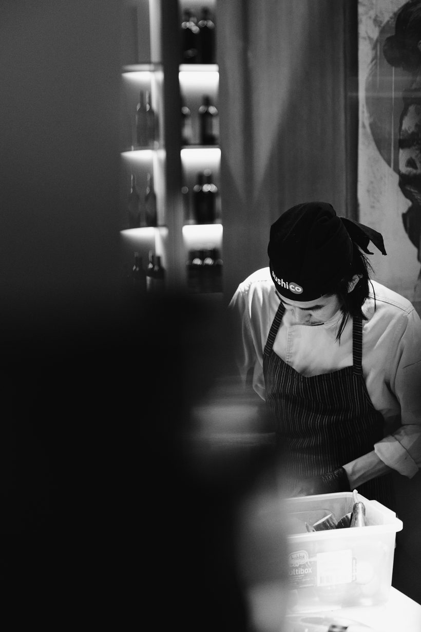 Black and white shot of a sushi chef at work
