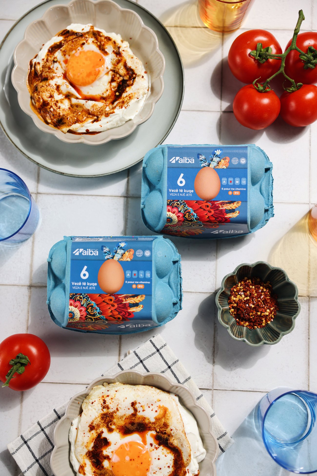 Cilbir with chilli butter beside two blue AIBA six-egg cartons