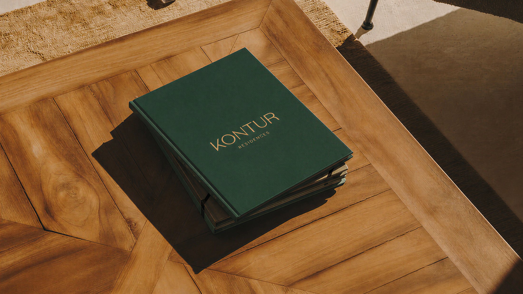 Green Kontur Residences book on a wooden coffee table