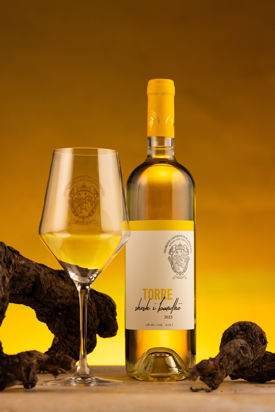Torre white wine with a glass on golden light
