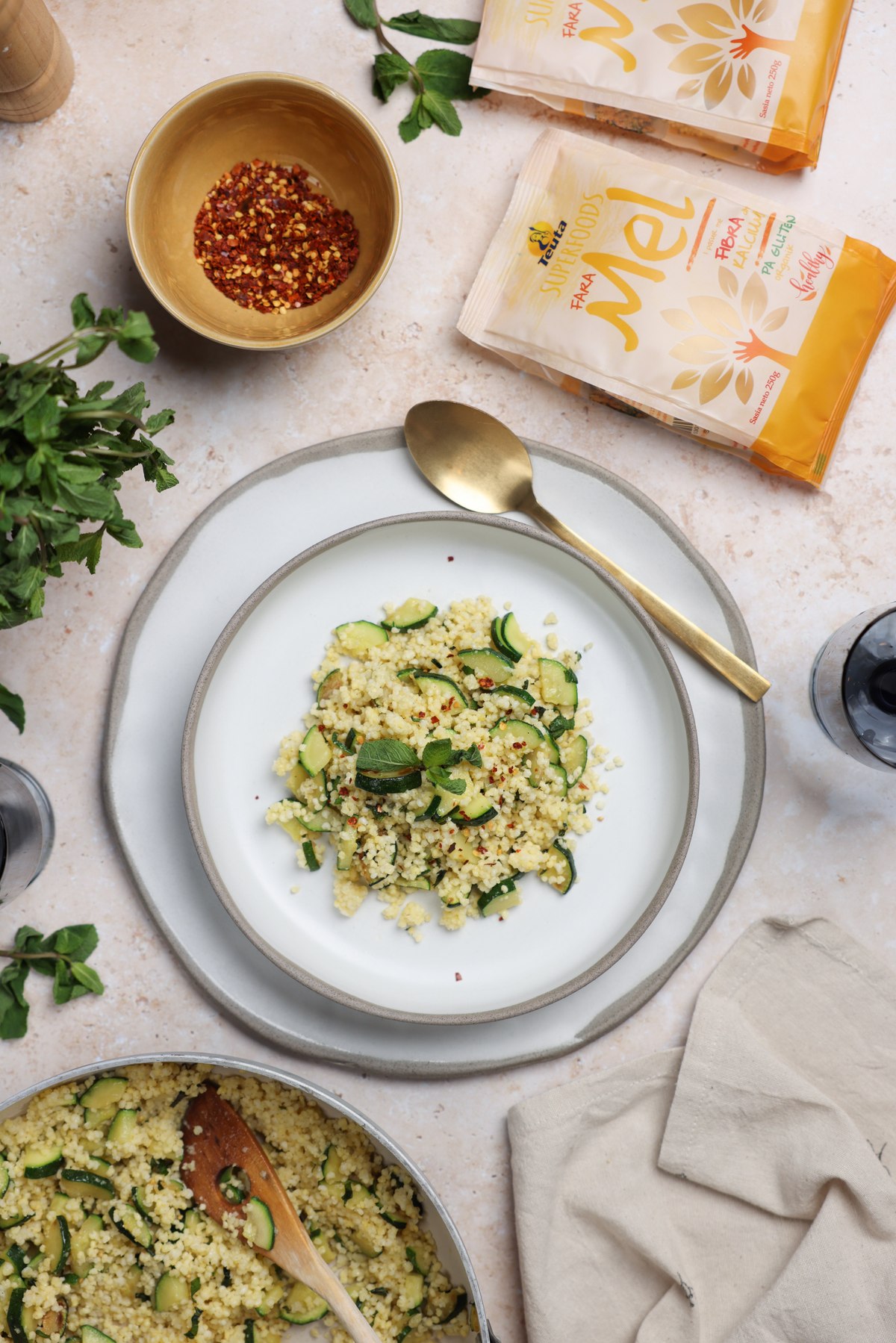 Millet with courgette and mint beside Teuta Superfoods millet packs