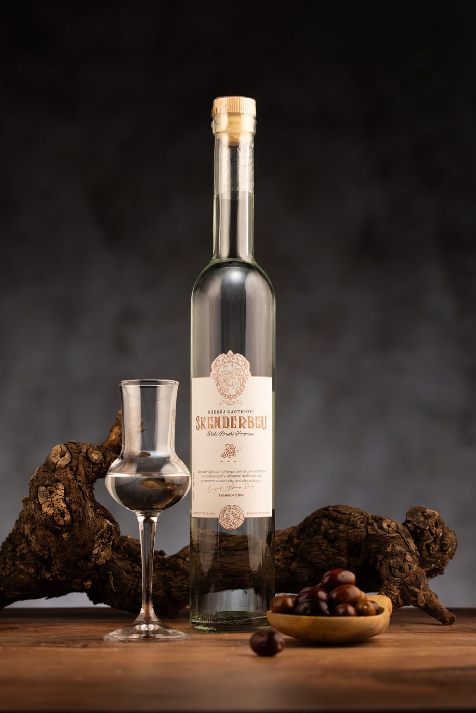 Skënderbeu Raki Rrushi Premium with olives and vine wood