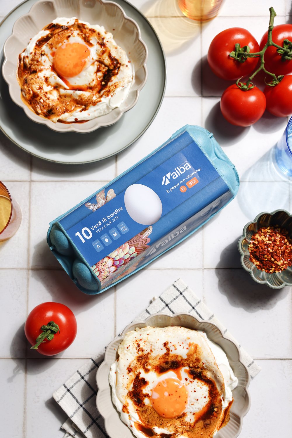 Cilbir on a tiled table with an AIBA ten white egg carton