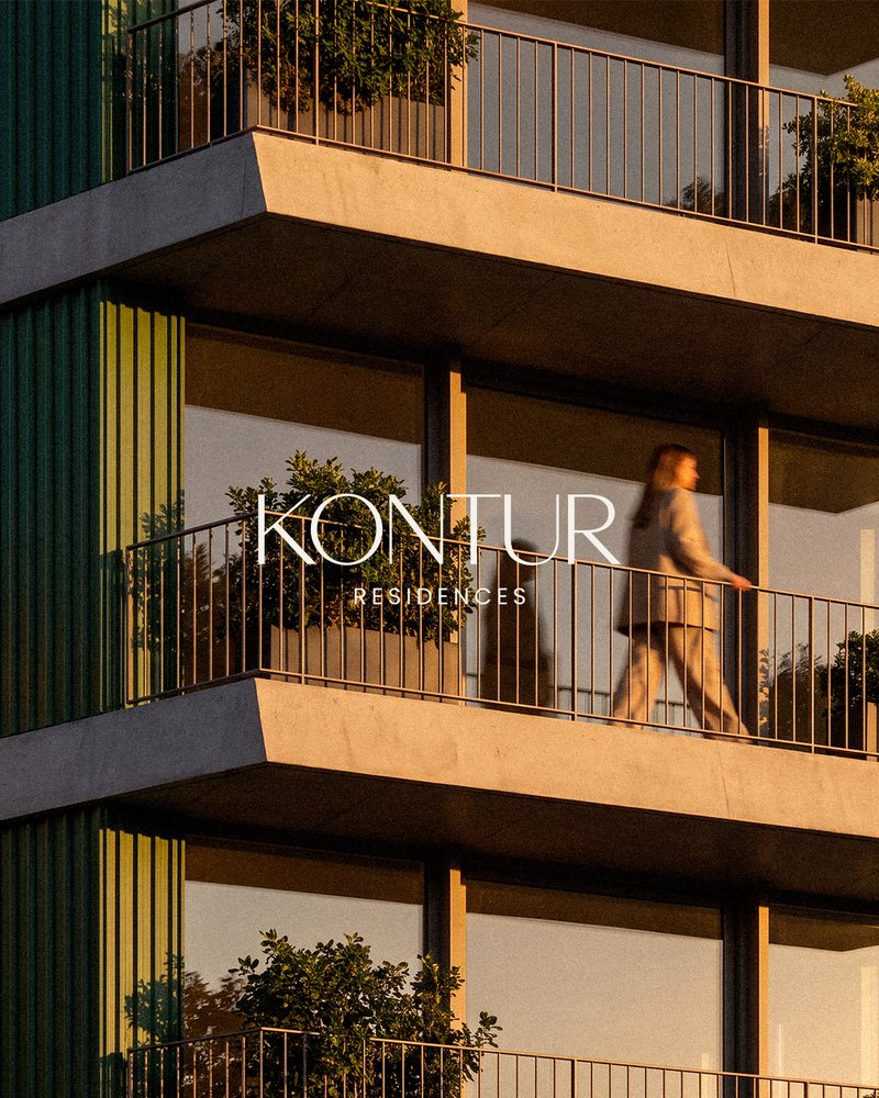 Woman walking along a Kontur Residences balcony at golden hour