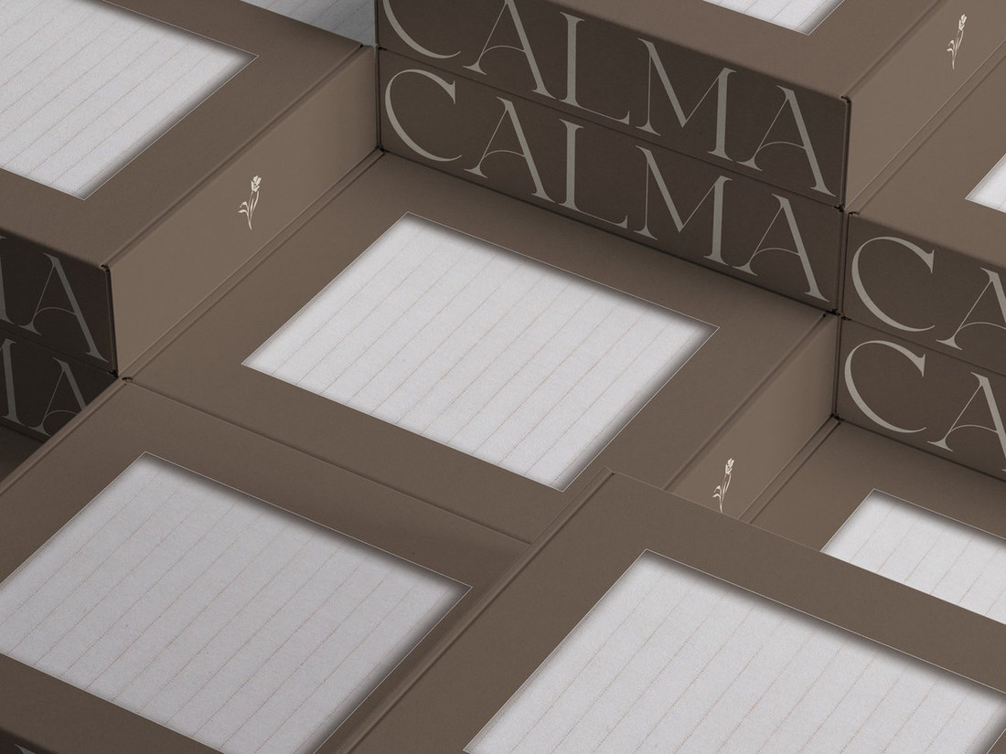 Stacked brown Calma linen boxes with window cutouts