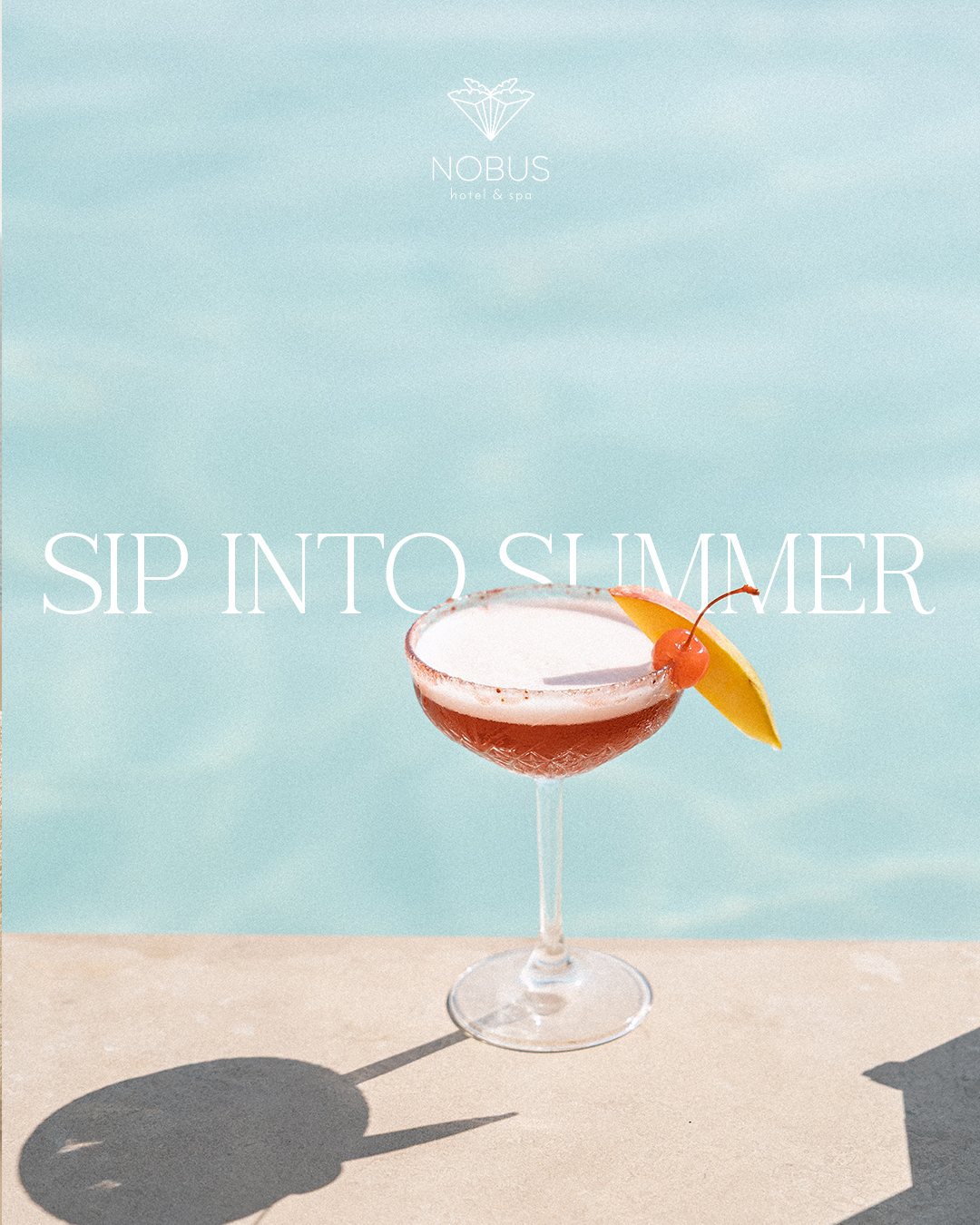 Sip into Summer post: a cocktail on the pool edge